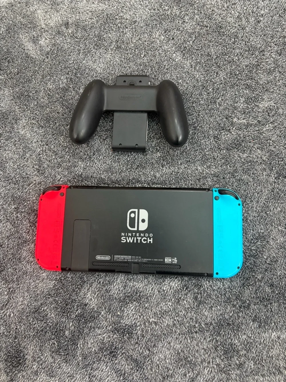 Nintendo Switch with Red & Blue Joy-Con Controllers + hand held controller